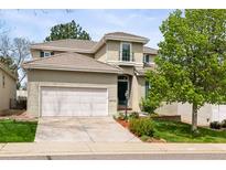 Charming two-story home featuring a tile roof, attached two car garage, and well-maintained landscaping at 8073 S Albion St, Centennial, CO 80122