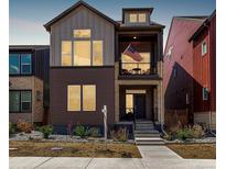 Two-story home with mixed siding, covered porch, and a walkway to the front door at 16762 Tejon Ln, Broomfield, CO 80023