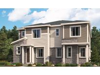 Beautiful two-story home featuring stone accents, neutral siding and well manicured landscaping at 24098 E Warm Springs Ave, Aurora, CO 80019