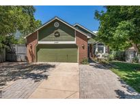 Charming single-Gathering home with a brick facade and a well-manicured lawn on a sunny day at 10957 Bryant St, Westminster, CO 80234