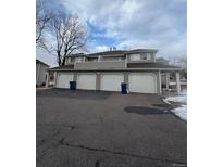 Exterior view of a townhome building with four garages at 12652 E Warren Dr # C, Aurora, CO 80014