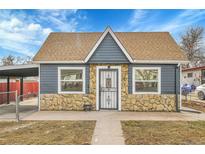 Charming single-story home with a combination of stone and siding facade, complemented by a well-maintained front yard at 3368 W Gill Pl, Denver, CO 80219