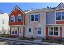 Charming multi-colored townhomes with individual entryways and manicured landscaping at 6776 S Holland Way, Littleton, CO 80128