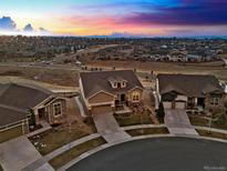 Aerial view of a beautiful neighborhood with a stunning sunset in the background at 22980 E Del Norte Cir, Aurora, CO 80016