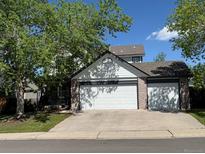 Charming home featuring an attached two-car garage, mature trees, and inviting curb appeal at 9638 Marion Way, Thornton, CO 80229