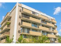Condo building featuring private balconies, offering residents a blend of indoor-outdoor living and views at 799 Dahlia St # 201, Denver, CO 80220