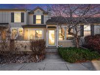 Well-maintained townhome with attractive landscaping and inviting entryway at 897 S Granby Cir, Aurora, CO 80012