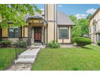 Charming home with a well-manicured lawn and neutral-colored facade with stone and brown accents at 18538 E Whitaker Cir # A, Aurora, CO 80015