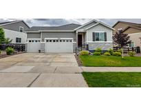 Charming two-story home with landscaped yard and attached two car garage at 22662 E Narrowleaf Cir, Aurora, CO 80016
