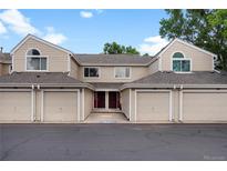 Charming townhome featuring individual garages and inviting entryway at 7476 E Arkansas Ave # 1-03, Denver, CO 80231