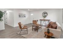 Bright living room with hardwood floors, modern furnishings, and stylish decor at 1326 Sable Blvd, Aurora, CO 80011