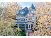 Charming Victorian home featuring a turret, balcony, and inviting front porch at 1459 N Pennsylvania St # B, Denver, CO 80203