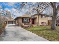 Charming single-Gathering home with brick exterior, welcoming front porch, and long driveway to a detached garage at 7930 Quitman St, Westminster, CO 80030
