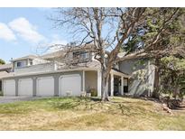 Charming townhome with a three-car garage and well-maintained front lawn at 12560 E Warren Dr # E, Aurora, CO 80014