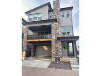 Two-story home with stone accents and a modern design at 15682 W Girard Ave, Morrison, CO 80465