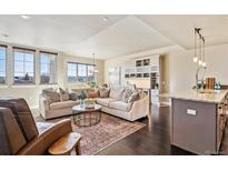 Spacious living room with hardwood floors and ample natural light at 5592 S Nevada St # 306, Littleton, CO 80120