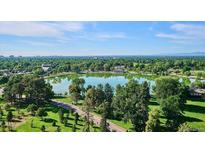 Scenic aerial view showcasing the serene lake and lush green surroundings at 480 S Marion Pkwy # 1606, Denver, CO 80209