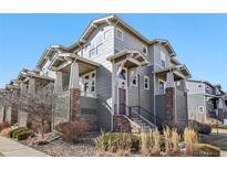 Three-story condo featuring attractive architecture and landscaping at 1601 Venice Ln, Longmont, CO 80503