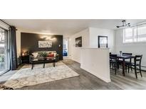 Inviting living room features a cozy seating area, contemporary decor, and stylish accents at 1525 S Holly St # 106, Denver, CO 80222
