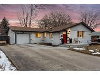 Charming ranch-style home featuring a painted brick exterior, well-kept lawn, and a cozy front porch at 5993 Field St, Arvada, CO 80004