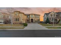 Beautiful two-story home with an extended driveway and attached garage, as seen from street level at 26656 E Peakview Dr, Aurora, CO 80016