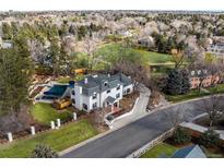 Stunning aerial view of estate with pool, manicured grounds, and mature trees in desirable neighborhood at 2 Sterling Ave, Cherry Hills Village, CO 80113