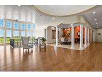 Bright living room with hardwood floors, soaring ceilings and elegant architectural details at 634 County Road 37, Brighton, CO 80603