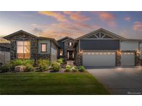 Charming two-story home with stone accents and a well-manicured lawn at 22609 E Eads Cir, Aurora, CO 80016