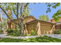 Charming single-Gathering home features a two-car garage, mature trees, and a well-maintained lawn at 7500 E Dartmouth Ave # 22, Denver, CO 80231