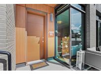 Modern entryway with wood and stone accents, welcoming you into this beautiful home at 4200 W 17Th Ave # 49, Denver, CO 80204