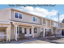 Charming condo with beige siding, covered entry, and well-maintained landscaping at 8975 Field St # 39, Broomfield, CO 80021