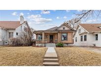 Charming brick home with a landscaped yard and inviting entryway in a quiet neighborhood at 2617 Albion St, Denver, CO 80207