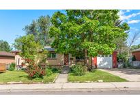 Charming brick home with mature landscaping and a detached garage at 8960 Judson St, Westminster, CO 80031