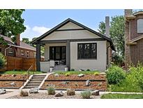 Charming home featuring new landscaping and a cozy front porch at 2569 Forest St, Denver, CO 80207