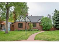 Charming brick home with a well-maintained lawn and beautiful landscaping at 770 Locust, Denver, CO 80220