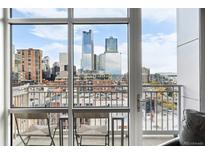 Balcony features a stunning city view, complete with seating and an open, airy ambiance at 1411 Wynkoop St # 806, Denver, CO 80202