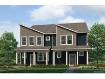 Charming two-story townhome showcasing modern architectural design and a well-manicured lawn at 1397 S Chester St # A, Denver, CO 80247