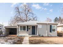 Charming single-story home with a well-maintained exterior, blue shutters, and an inviting entrance at 4165 S Grant St, Englewood, CO 80113