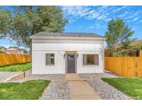 Charming single-story home with a fresh exterior and neat landscaping for great curb appeal at 3452 S Clay St, Englewood, CO 80110