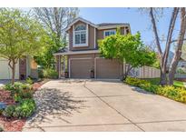 Charming two-story home with a well-maintained front yard and an inviting driveway at 2364 S Harlan St, Lakewood, CO 80227