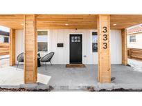 Charming front porch featuring modern chairs and wood accents at 333 Quitman St, Denver, CO 80219