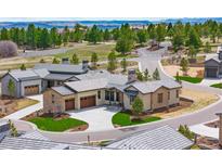Beautiful exterior elevation showcasing professional landscaping and views of the scenic community at 8015 Parnassus Pl, Castle Rock, CO 80108