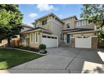 Charming two-story home featuring a three-car garage, tasteful landscaping, and a welcoming façade at 10601 Chadsworth Ln, Highlands Ranch, CO 80126