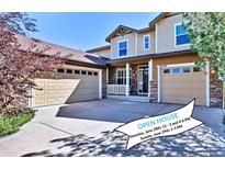 Charming two-story home featuring a three-car garage and well-maintained landscaping at 10646 Amesbury Way, Highlands Ranch, CO 80126