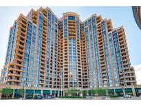 A stunning full exterior view of the high-rise Penterra Plaza building showing all the balcony's and windows at 8100 E Union Ave # 310, Denver, CO 80237