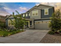 Beautiful two-story home featuring a two-car garage and a well-manicured front yard with stone accents at 800 Meadowlark Dr, Erie, CO 80516