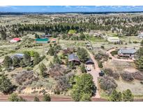 Expansive aerial view of the property showcasing the home, surrounding landscape and neighborhood at 7715 Rafter Rd, Franktown, CO 80116