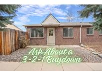 Charming brick home featuring a quaint front entrance and well-maintained landscaping at 2545 W 45Th Ave, Denver, CO 80211