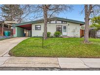 Charming single-story home with a well-manicured lawn and a covered carport at 7948 Stuart St, Westminster, CO 80030