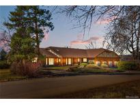 Charming single Gathering home with mature trees, and attached three car garage at 6980 Oak St, Arvada, CO 80004